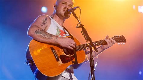 Delcoanny's Soulful Surrender: Zach Bryan's Heartbreaking Masterpiece
